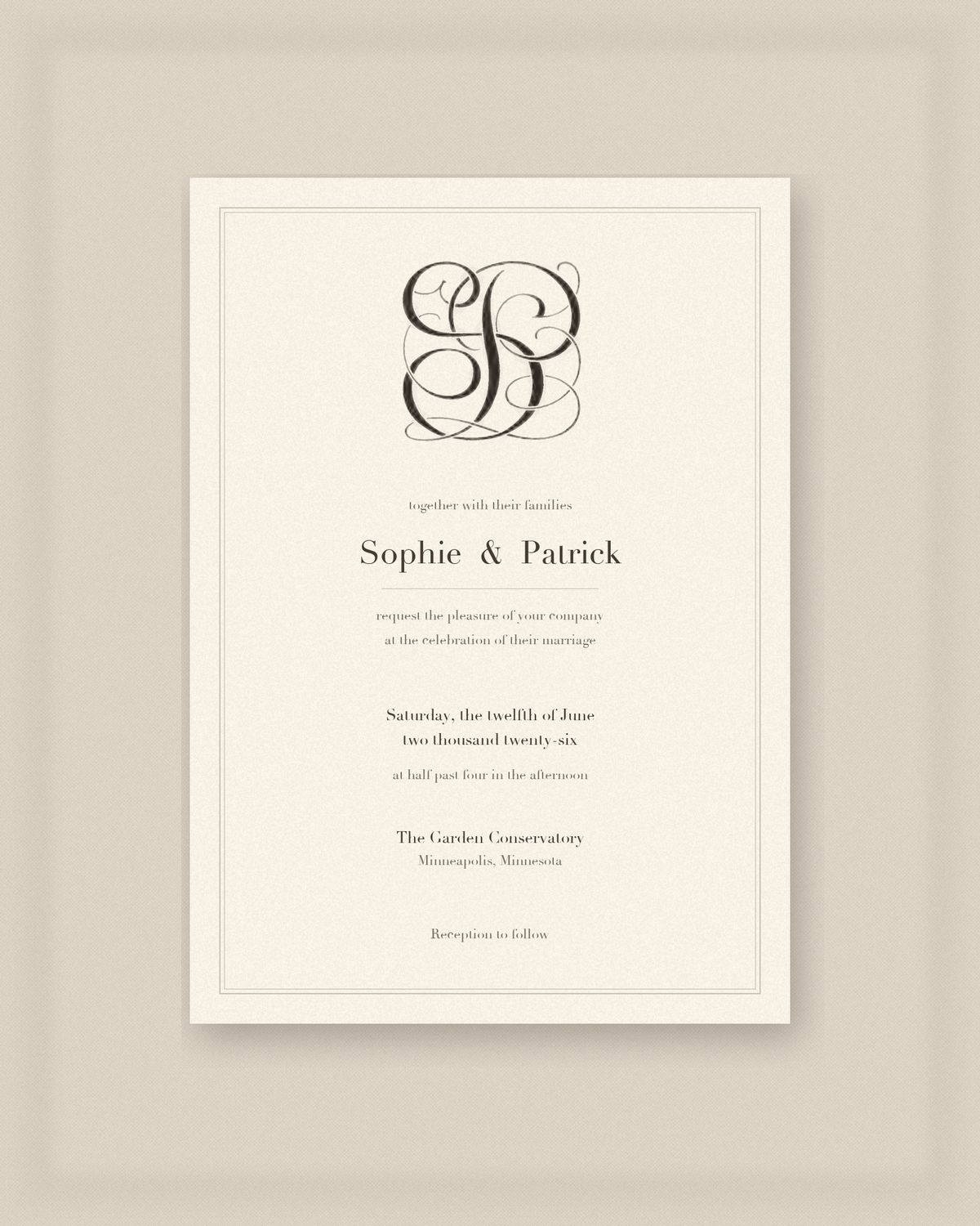 Monogram on a cream wedding invitation